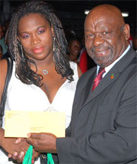Carnival Chairman Gus Williams Congrtulates Female Bachanal Queen Anastasha
