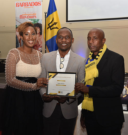 BCA Chair & President Mark Hoyte (right) and Vice-President Reeva Goodman present a Certificate of Appreciation to a member of the community during 2022's Independence event.